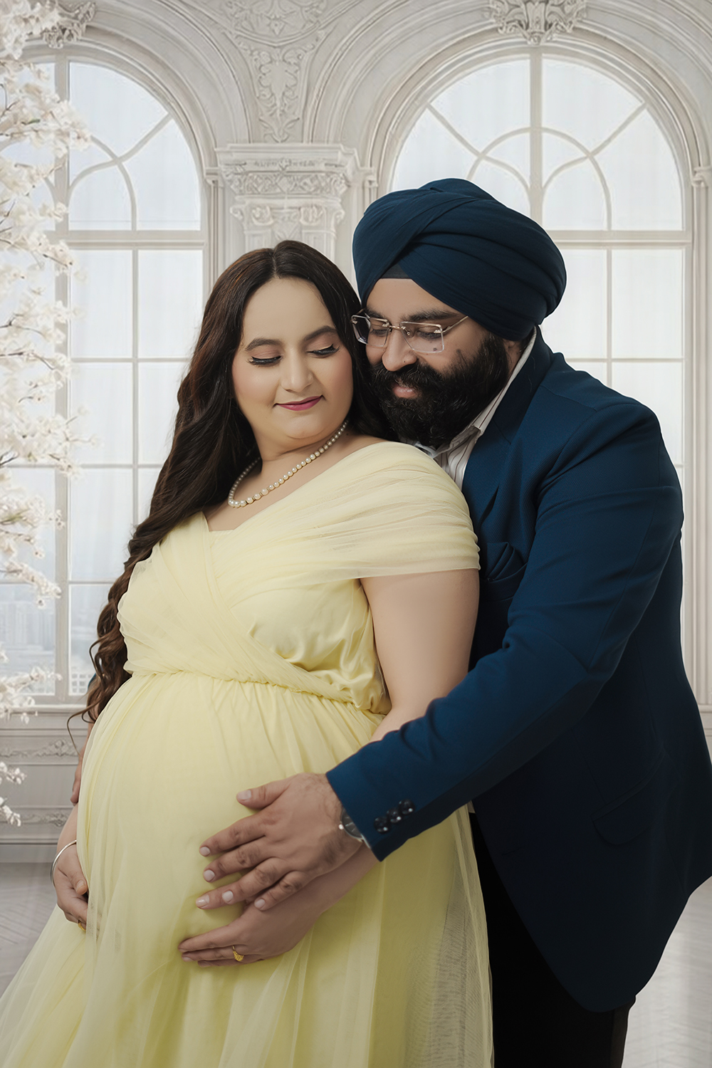 Expecting couple in yellow gown portrait