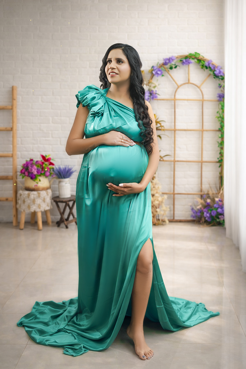 Expecting mother in teal gown